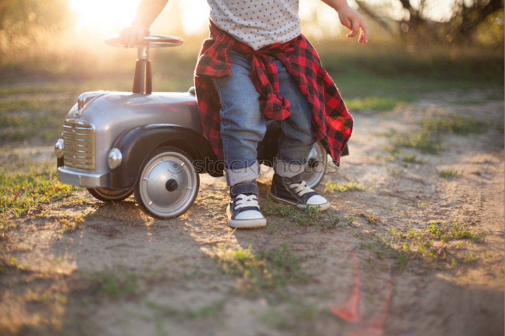 boy on the train tracks with suitcase