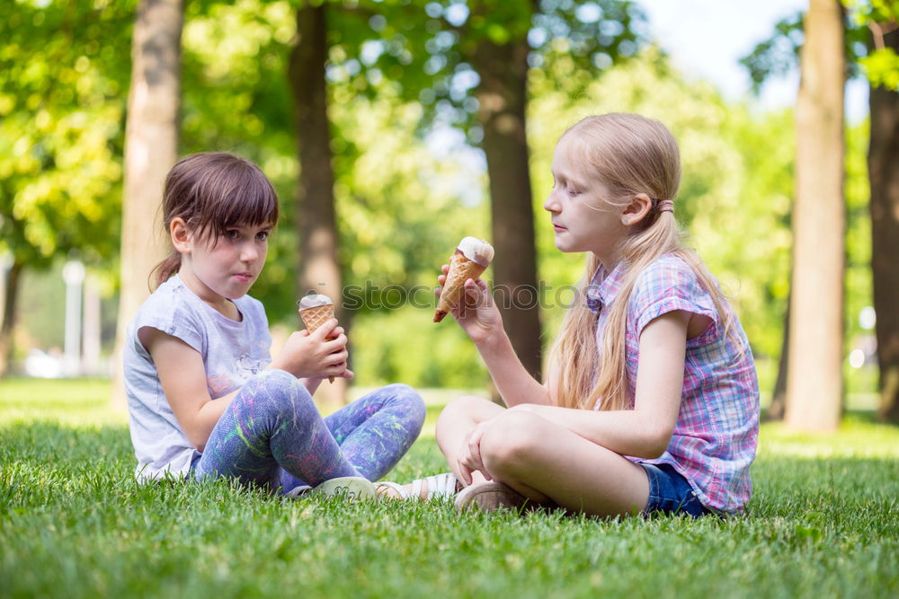 Similar – Image, Stock Photo Baby girl and child playing sitting on a grass park
