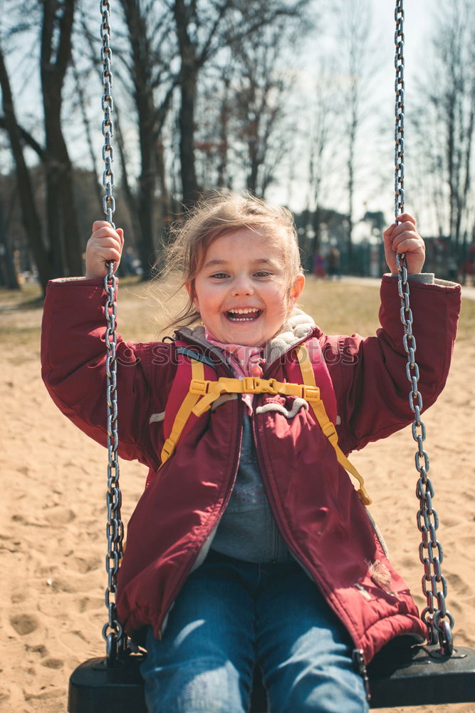 Similar – Image, Stock Photo Little cute girl swinging in a park on sunny spring day