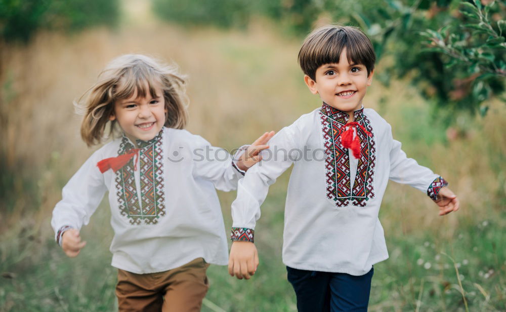 happy brothers sitting in the park