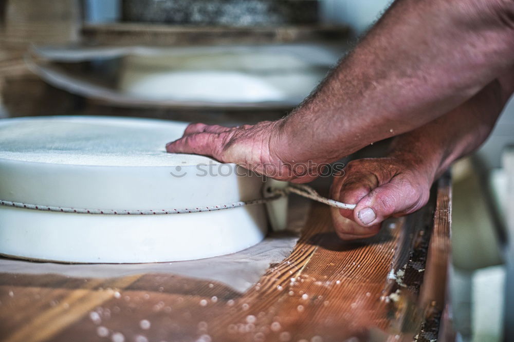 Similar – close up view of woman hand cutting nuts with knife