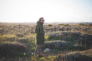 Similar – Tourist with camera on field