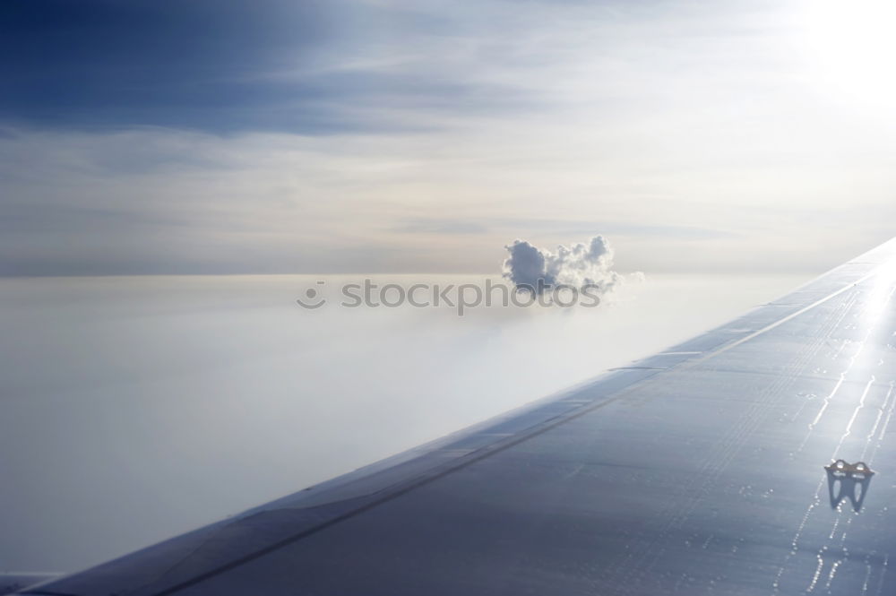 Similar – above the clouds Airplane