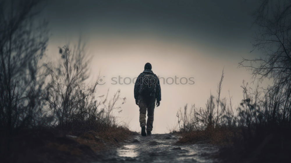 Similar – Mother and son in fog by river quietly watching ducks