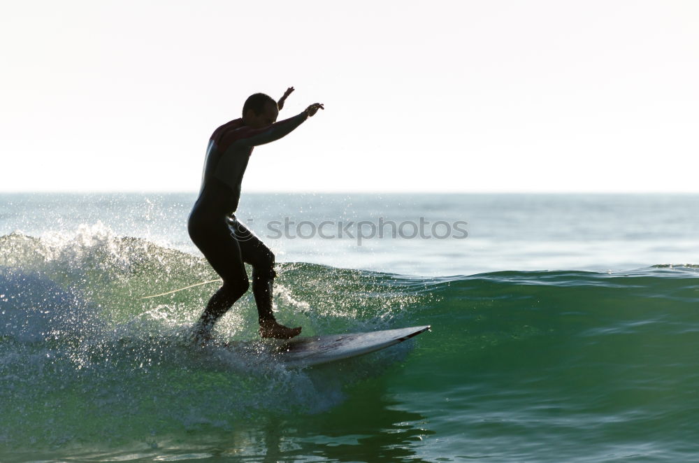 Similar – Image, Stock Photo Man in wetsuit swimming in ocean