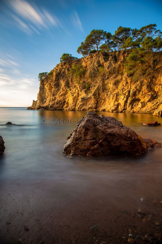 Similar – A Natural Arch on the Coast at Golden Hour