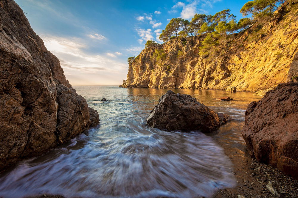 Similar – A Natural Arch on the Coast at Golden Hour