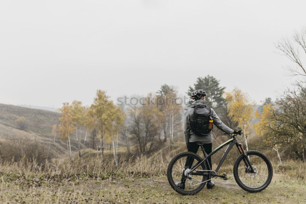 Similar – Cyclist Riding a Bike at sunset. Sports