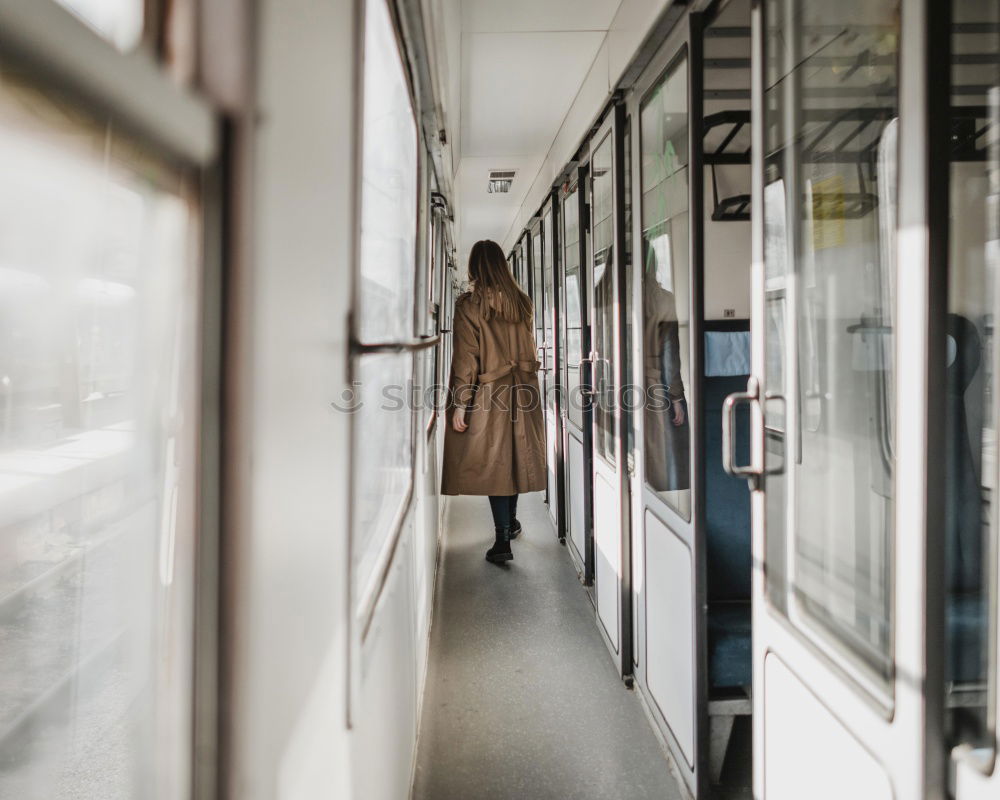 Similar – Image, Stock Photo Young woman with face mask and dog traveling by train.Train travel during pandemic