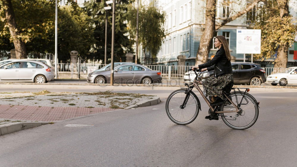 Similar – Handsome afro man walking with his bike.