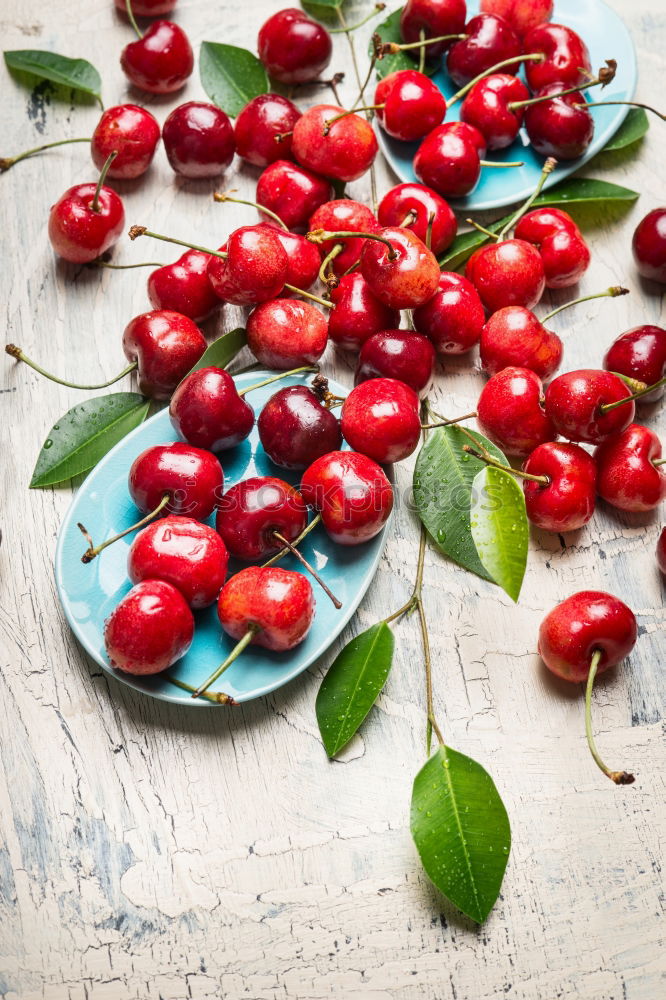 Similar – Image, Stock Photo Scattered cherries with green leaves