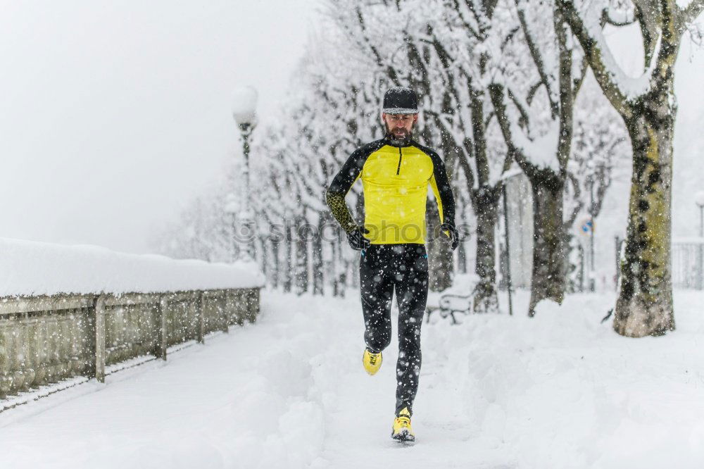 Similar – Man jogging in winter clothing