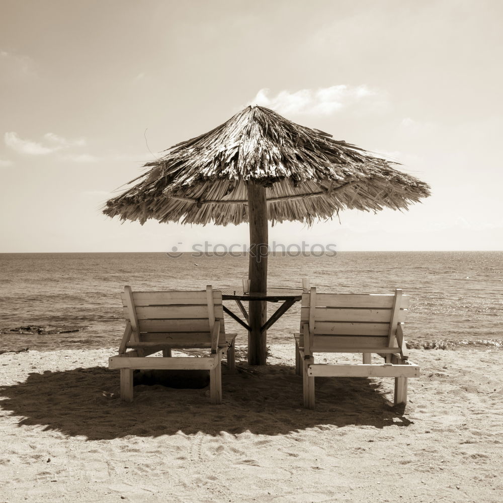 Similar – Straw umbrellas on the beach