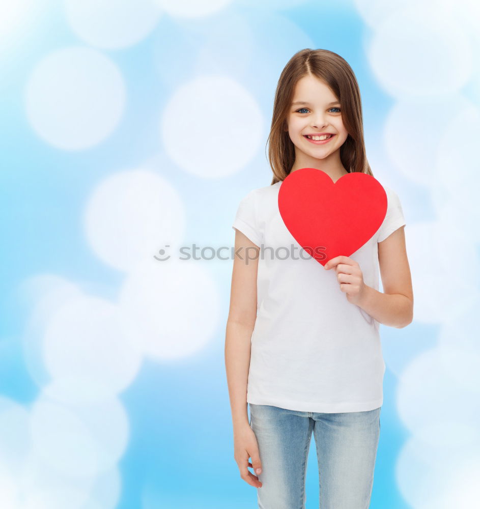 Similar – Image, Stock Photo smiling girl with a heart covering her lips on blue background
