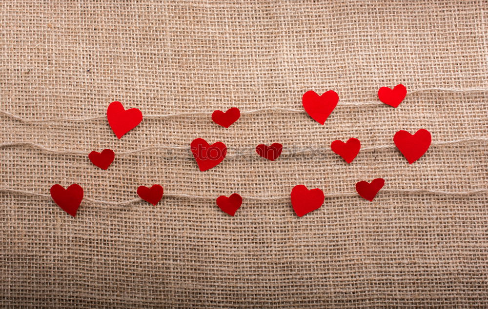 Image, Stock Photo Red heart shaped wooden sewing buttons on canvas