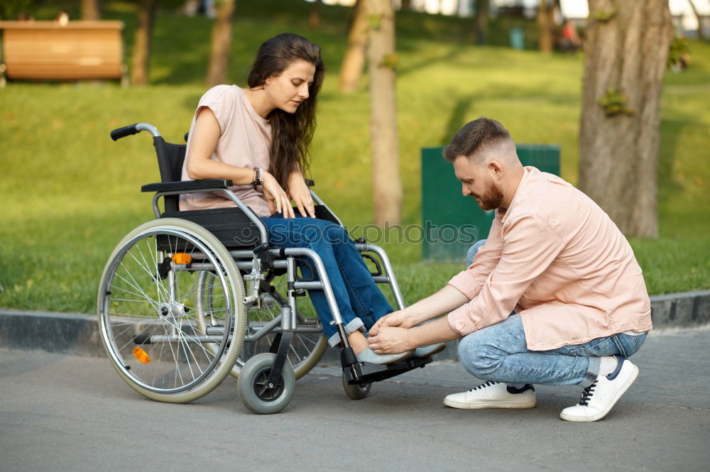 Similar – Foto Bild Frau und ihr Freund im Rollstuhl machen einen Spaziergang durch den Park an einem Fluss und genießen den Herbst