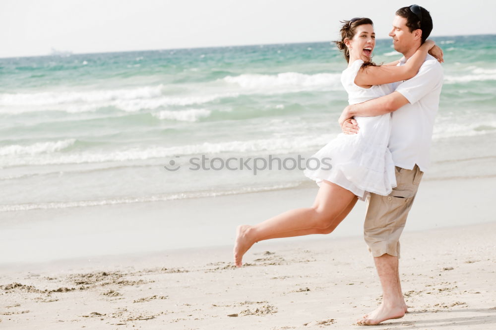 Similar – Happy father and son playing on the beach