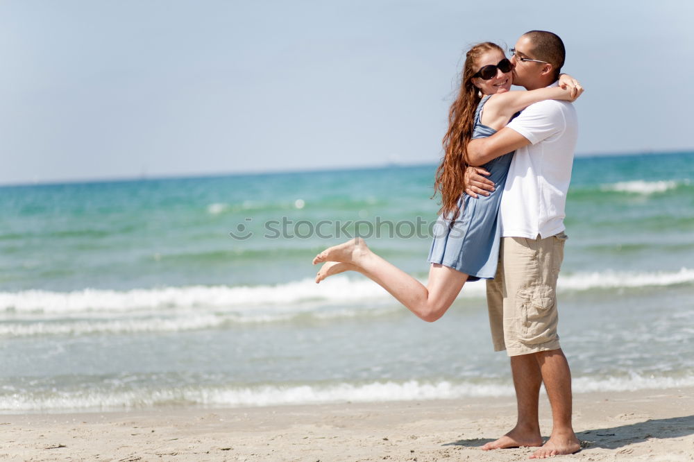 Similar – Happy father and son playing on the beach