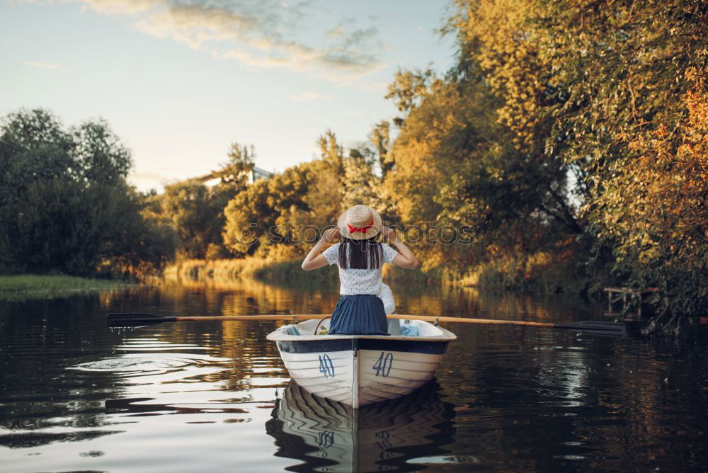 Similar – Image, Stock Photo Boy sitting on air-filled plastic crocodile in a lake