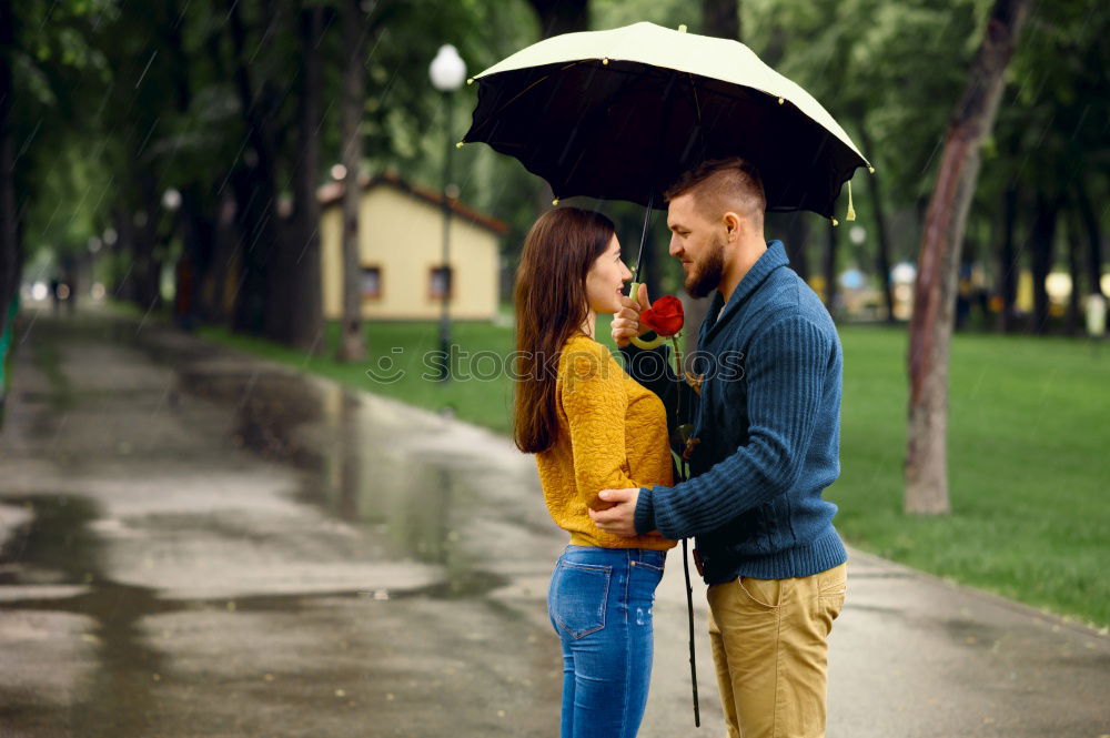 Similar – Woman with gift box in hand embracing and kissing to boyfriend