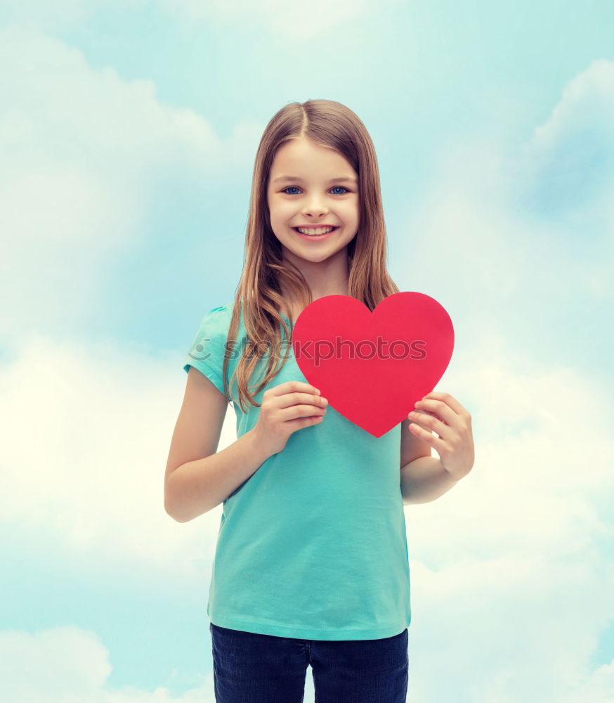 Similar – Image, Stock Photo smiling girl with a heart covering her lips on blue background