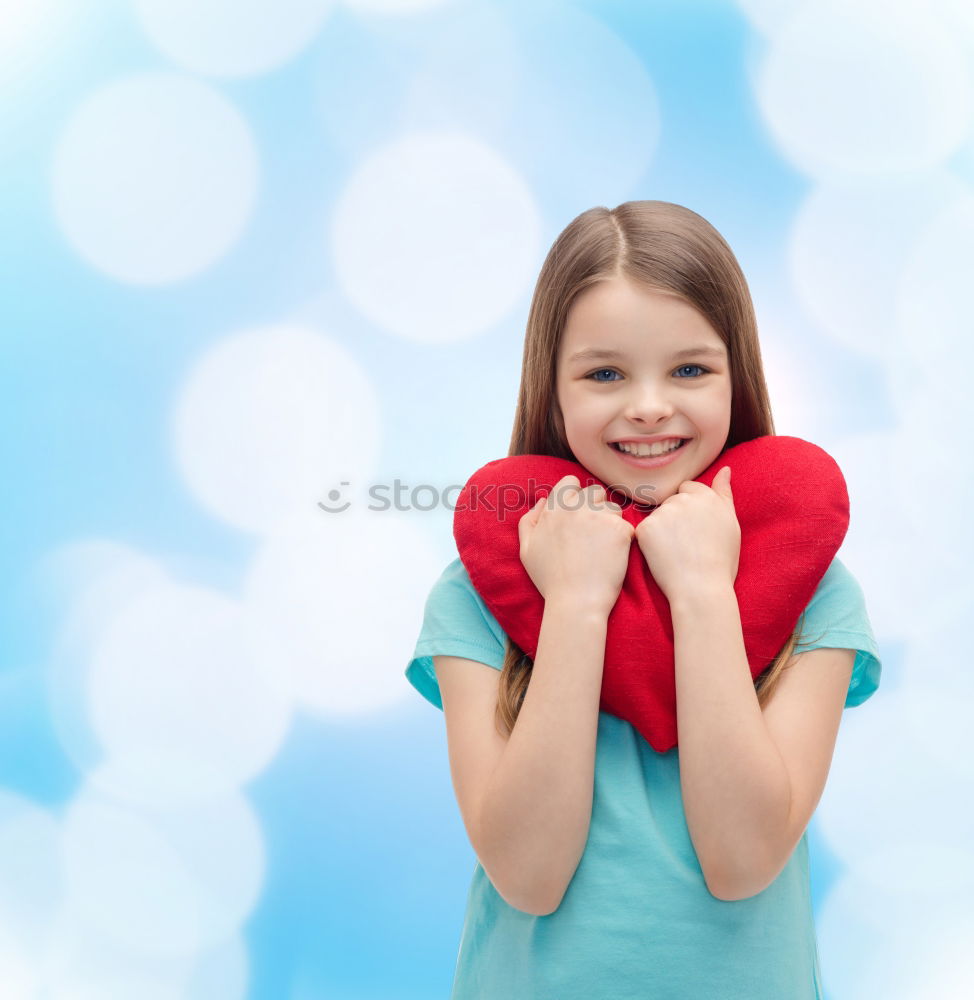 Similar – Image, Stock Photo smiling girl with a heart covering her lips on blue background