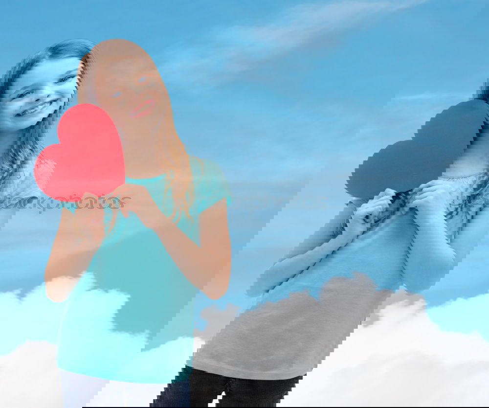 Similar – Image, Stock Photo smiling girl with a heart covering her lips on blue background