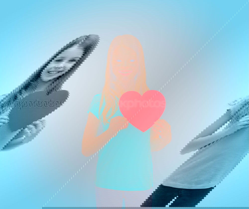 Similar – Image, Stock Photo smiling girl with a heart covering her lips on blue background