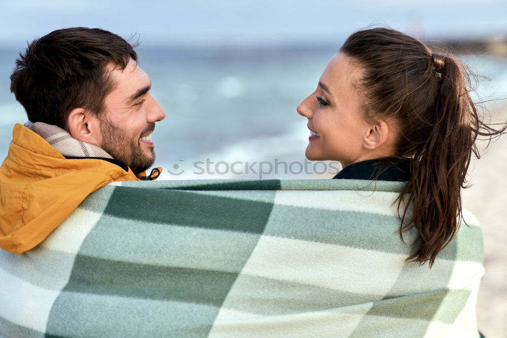 Similar – Young couple embracing under umbrella in a rainy day