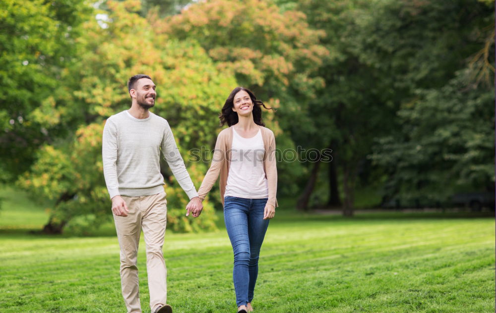 Similar – Beautiful young couple laying on grass in an urban park