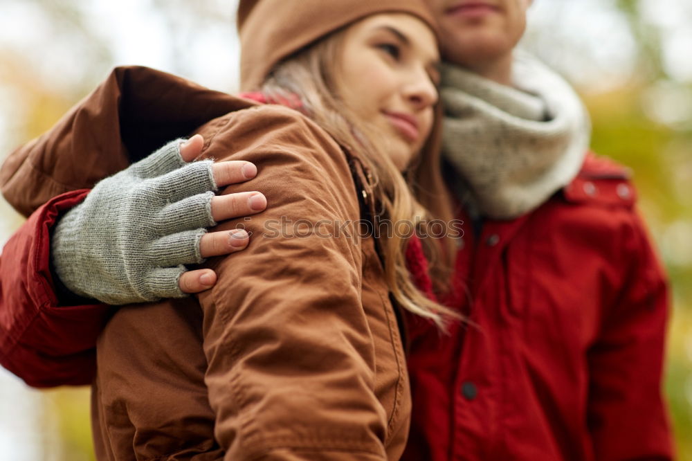 Similar – Young couple embracing and having hot beverage outdoors