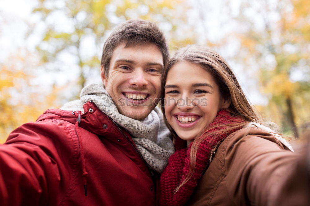 Similar – Young couple taking selfie photo with smartphone outdoors