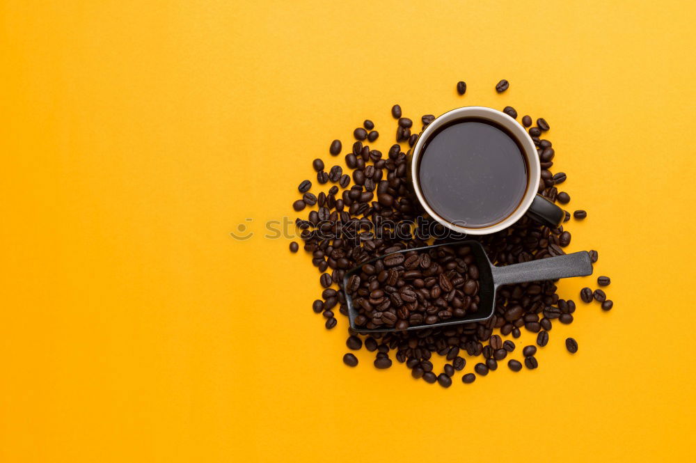 Similar – Top view of black coffee and coffee beans on yellow