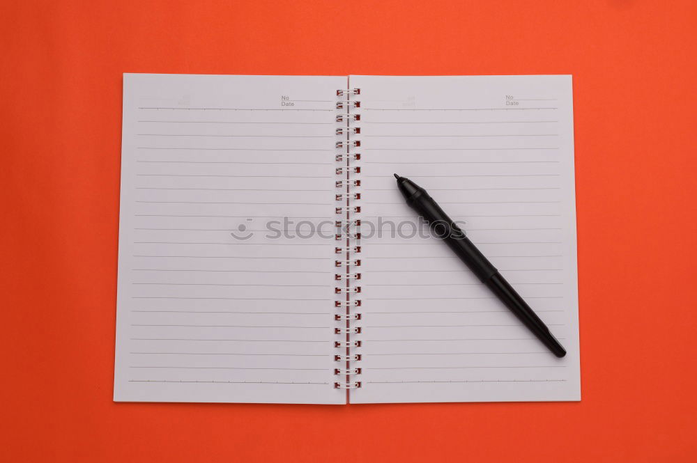 notebook with white sheets and a crumpled sheet of paper