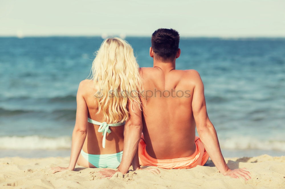 Similar – Image, Stock Photo Crop couple in swimsuit holding hands