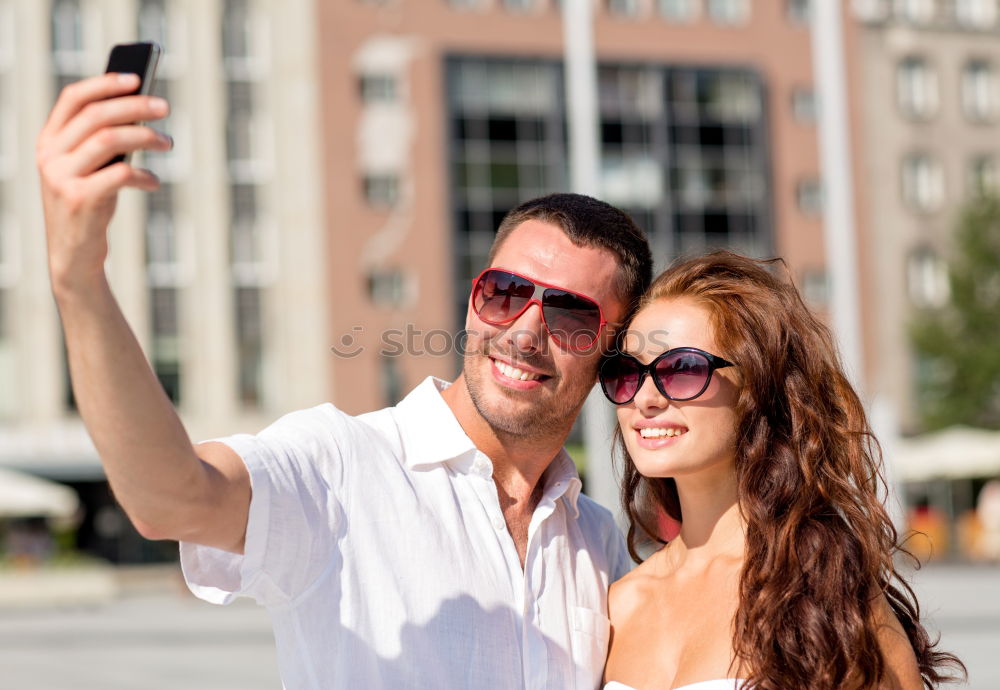 Similar – Image, Stock Photo Cheerful friends taking photos of themselves on smart phone