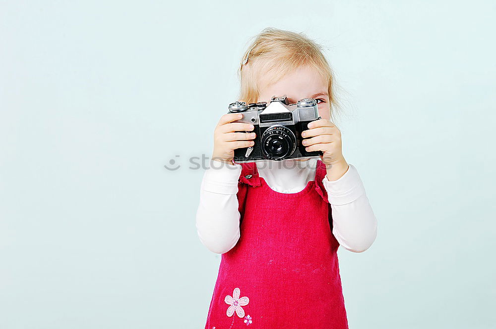 Similar – WOMAN WITH ANALOG CAMERA I