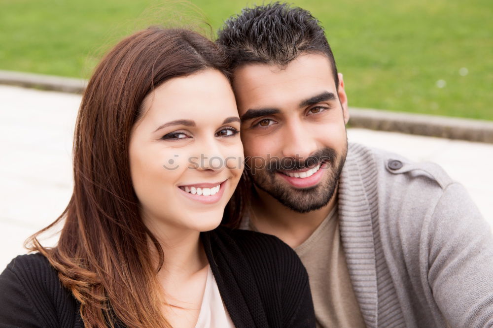 Similar – Beautiful young couple laying on grass in an urban park