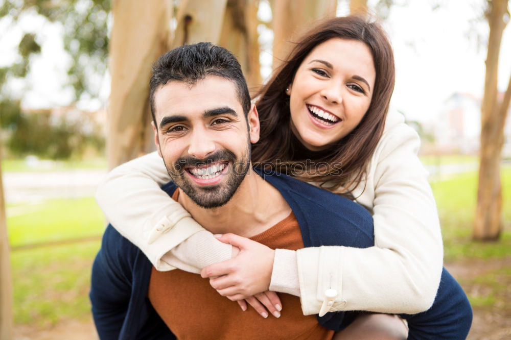 Similar – Beautiful young couple laying on grass in an urban park