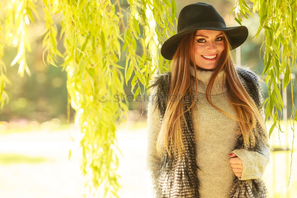 Similar – Image, Stock Photo Smiling blond woman with hat in urban background