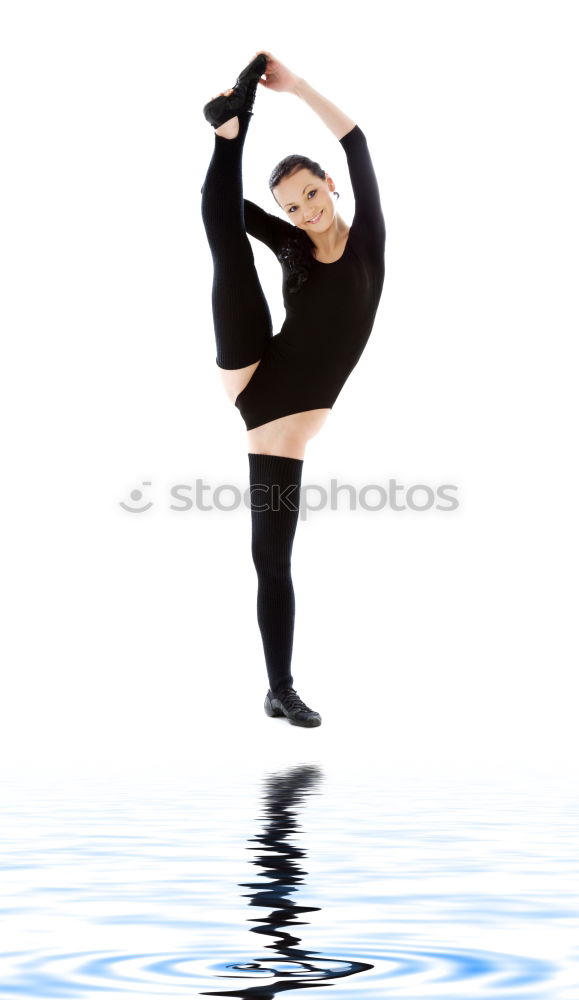 Similar – Teen rhythmic gymnast is holding leg in vertical split doing ribbon exercises.