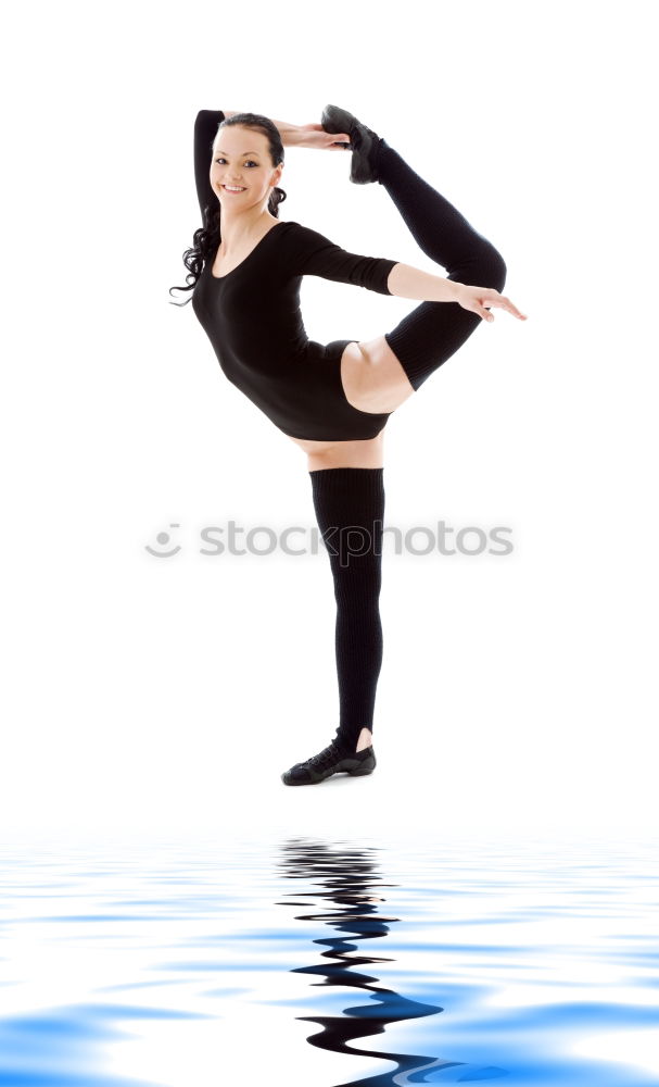 Similar – Teen rhythmic gymnast is holding leg in vertical split doing ribbon exercises.