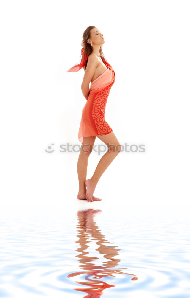 Similar – Mature brunette woman sunbathing by the pool with her feet in the water and a wrap around her body