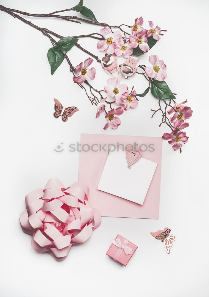 Similar – Table with cup of coffee, gift and pink tulips