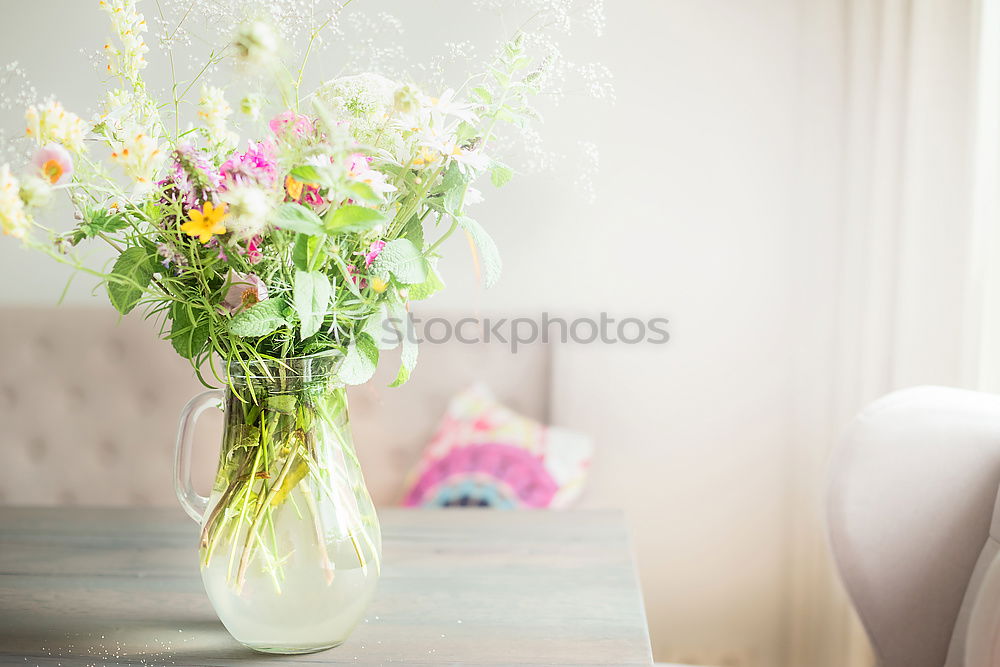 Similar – Image, Stock Photo Bouquet of flowers in a glass vase on the table in front of a window