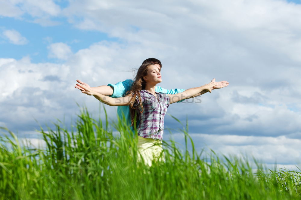 Similar – Young blonde woman on hill with globe in hands