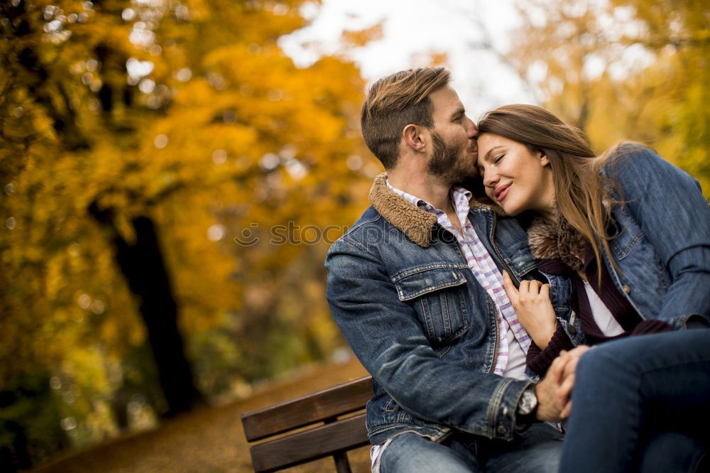 Similar – Young couple embracing under umbrella in a rainy day