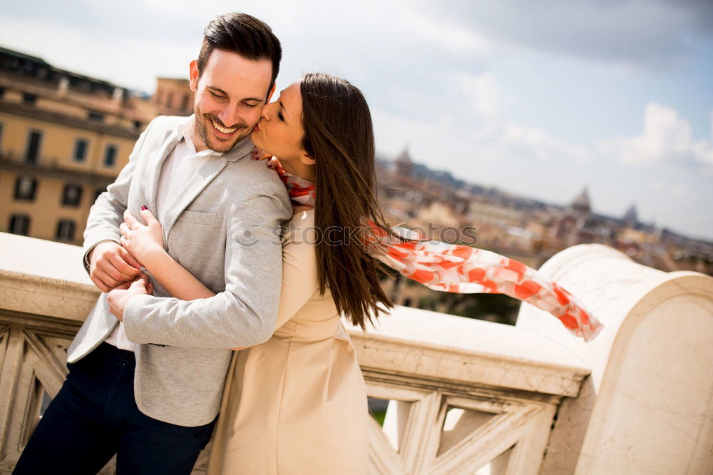 Similar – Happy loving couple. Happy young man piggybacking his girlfriend.