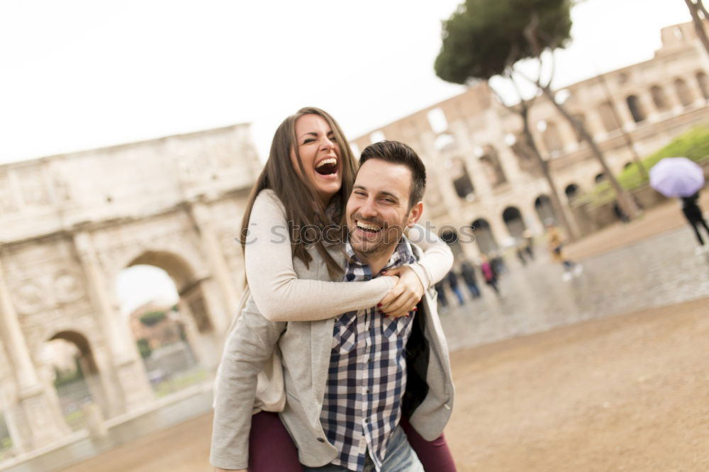 Similar – Happy loving couple. Happy young man piggybacking his girlfriend.