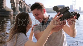 Similar – Image, Stock Photo Happy couple talking sitting near River Thames